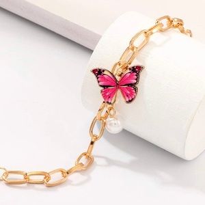 Gold tone pink butterfly bracelet